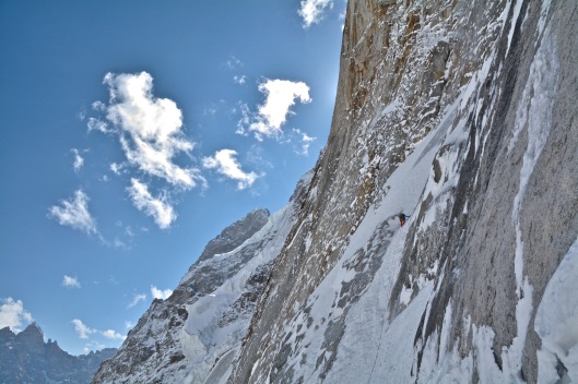Sam climbing up an ice runnel connecting two snowfields